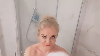 Mature Blonde Soaps Up Her Ample Bosom In The Bath